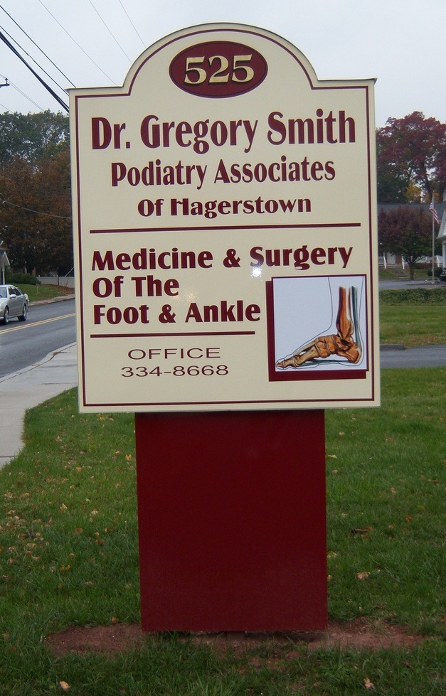 A sign for Dr. Gregory Smith Podiatry Associates of Hagerstown, specializing in foot and ankle care and surgery.