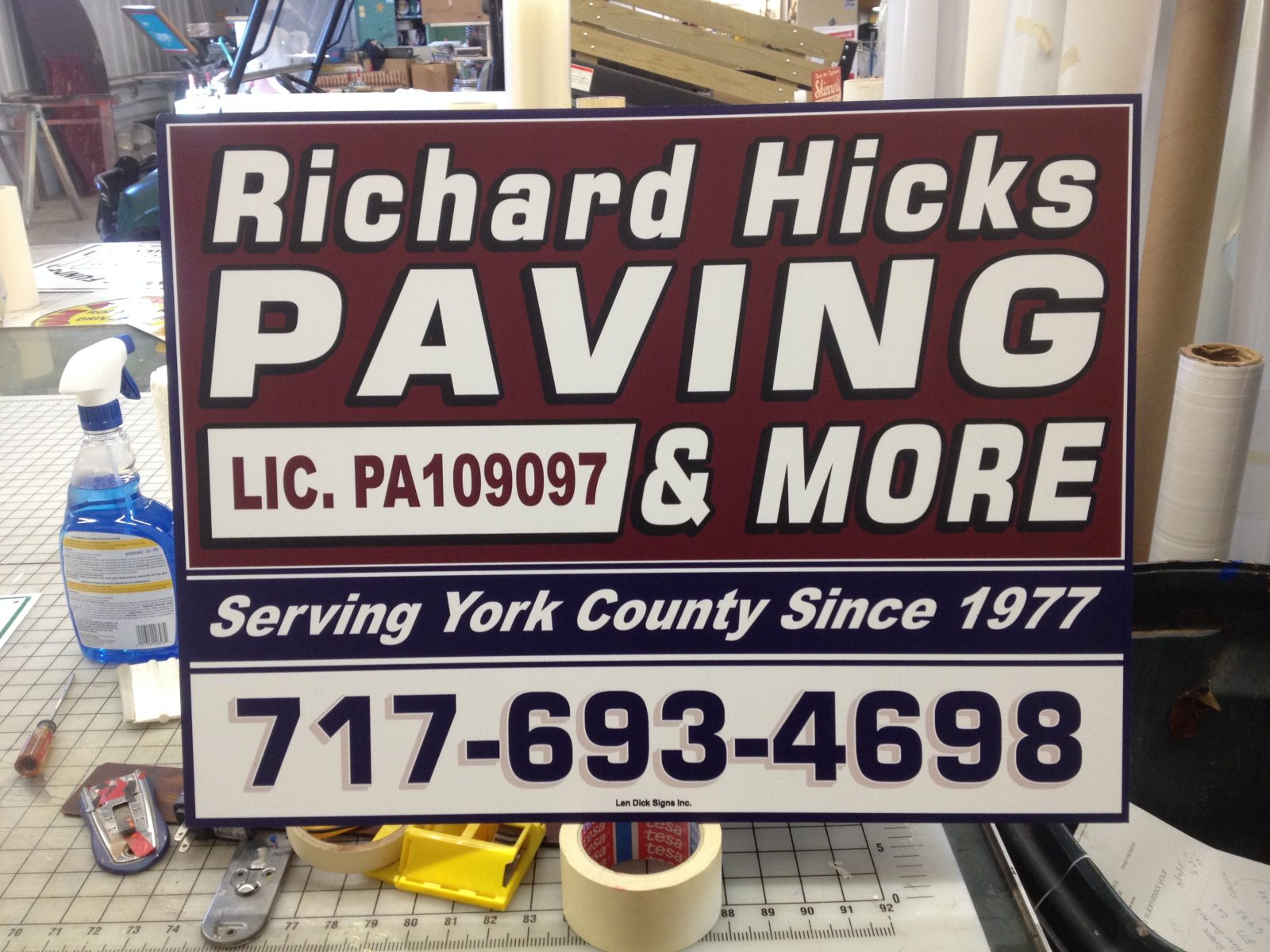 A yard sign for Richard Hicks Paving & More with contact info and license number, serving York County since 1977.