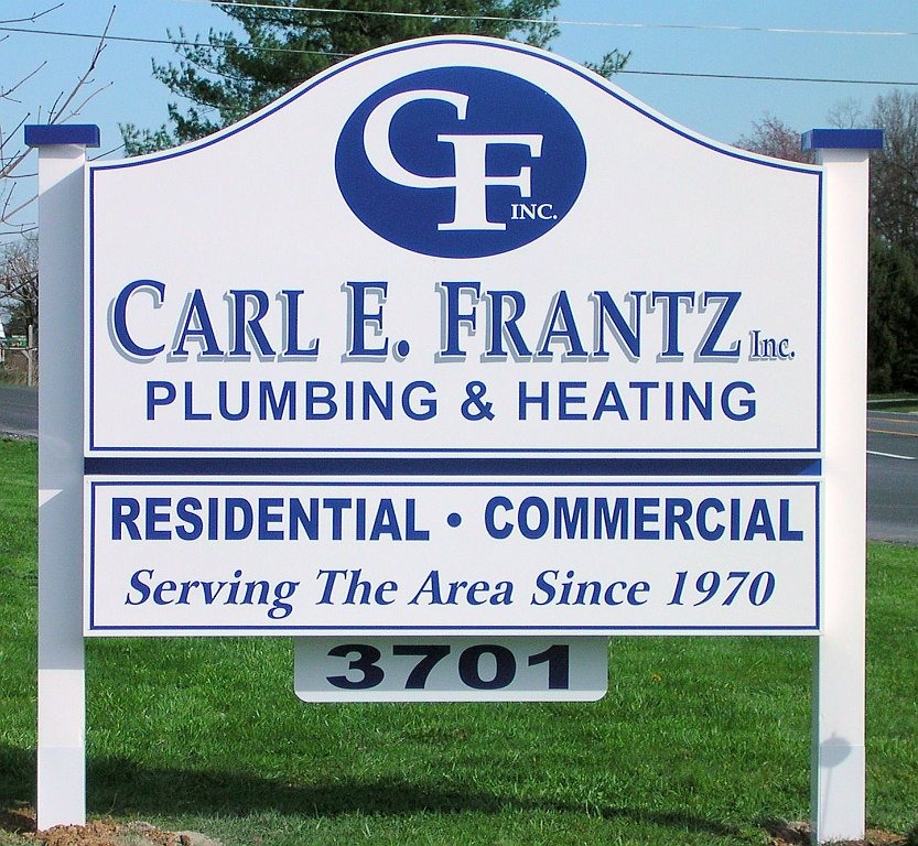 Sign for Carl E. Frantz Plumbing & Heating, offering residential and commercial services, established in 1970.